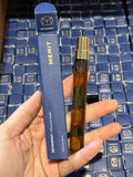 MERIT 
Retrospect™ L’Extrait de Parfum Travel Spray Size: 0.32 oz / 9.5 mL